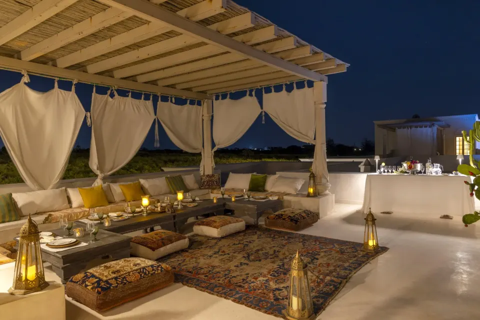 The rooftop terrace lounge with lanterns at night
